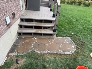 Stone landing beneath the deck stairs