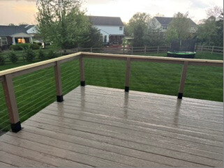 Finished wire deck railing overlooking the yard